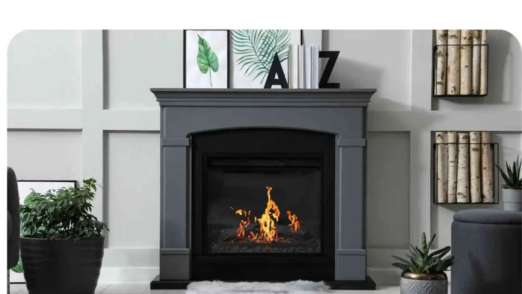 a grey fireplace in a room with white walls